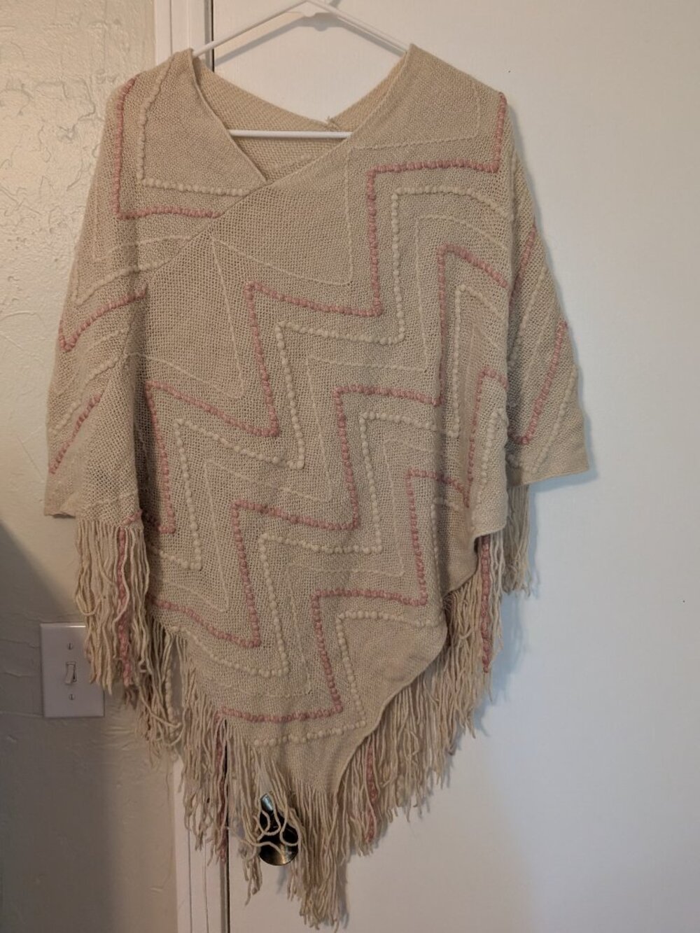 Knitted, cream and pink poncho